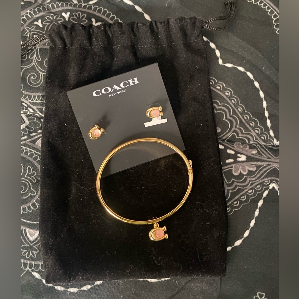 Coach gold tone bracelet and earrings.
